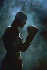 Wall Mural - A statue of a man holding a boxing glove