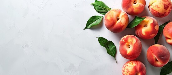 Poster - Fresh peaches displayed on a white table with copy space image