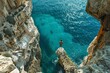 © Exotic Escape - Aerial View of Free Diver Ready to Dive into Clear Blue Waters.