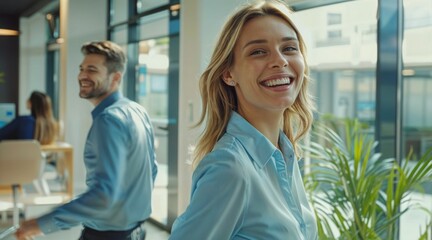 Poster -  Woman in office wearing blue shirt smiling. It's a healthy work environment.