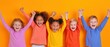© Gasi - Joyful children dancing in vibrant orange room, celebrating with raised arms