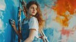 © Vlad - Woman Paint. Beautiful Caucasian Woman Decorating Apartment with Colourful Background