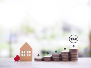 Poster - Miniature house and stack of coins with arrow rising. The concept of payment tax for house, Property investment, House mortgage, Real estate