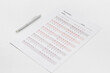© 9dreamstudio - Answer exam sheet form on a table, top view. Education background