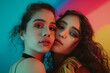 © WaxWing_Ai - Colourful studio portrait of two young women on colorful background