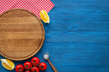 Wall Mural - Cooking layout with wooden cutting board and vegetables. Menu concept