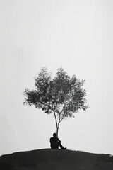 Wall Mural - A black and white sketch of a person sitting under a tree