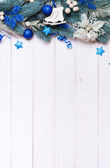 Wall Mural - Christmas background made from pine tree, berries and festive decorations with copy space.