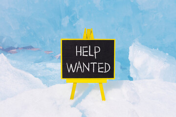 Wall Mural - Help wanted and support symbol. Concept words Help wanted on beautiful yellow black blackboard. Beautiful blue ice background. Business, support, help wanted concept. Copy space.