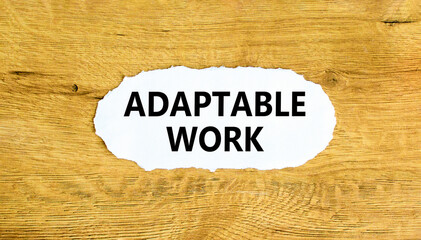 Adaptable work symbol. Concept words Adaptable work on beautiful white paper. Beautiful wooden wall background. Business Adaptable work concept. Copy space.