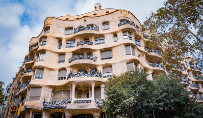 Barcelona, Spain; July, 11, 2024: Facade of the Casa Milla, house made by the famous architect Antonio Gaudi.