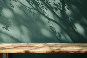 Poster - Empty light wood table with shadow of tree on dark green wall background, for product display montage
