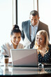 © ReeseArcurs/peopleimages.com - Man, women and laptop at desk for business, teamwork and planning for project in office. Technology, collaboration and brainstorming in workplace with ceo and female people or hr in conference room
