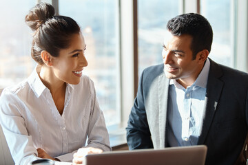 Smile, man and woman with laptop for business in office on transport network, investment opportunity and online. Investors, technology and communication on fleet management and revenue growth.