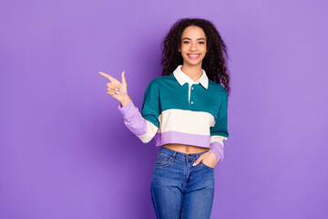 Wall Mural - Photo of nice young girl indicate finger empty space wear shirt isolated on violet color background