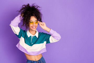 Wall Mural - Photo of nice young girl touch hair look empty space wear shirt isolated on violet color background