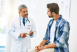 © peopleimages.com - Doctor, consultation and man for healthcare with help, conversation and diagnosis in clinic. Hospital, patient and communication for medicine and sick person, mature professional and medical results