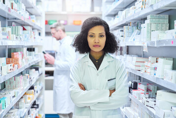 Wall Mural - Healthcare, confidence and portrait of woman in pharmacy with pride, advice and about us in drug store. Serious, arms crossed and pharmacist with wellness, prescription medicine and health insurance