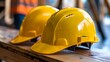 © Bilal - Worksite readiness Construction workers yellow helmet presented on a table