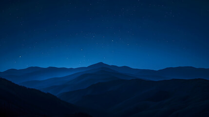 Wall Mural - A mountain range is silhouetted against a dark sky with a few stars visible