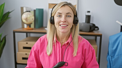 Sticker - Smiling woman with headphones in a bright office representing customer support.