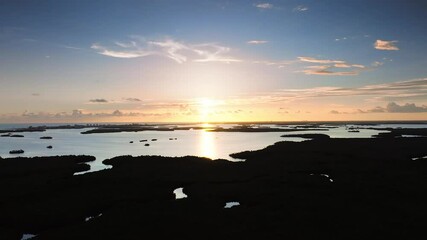 Wall Mural - drone view of sunset over water