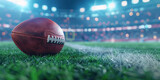 A football is on the field in a stadium