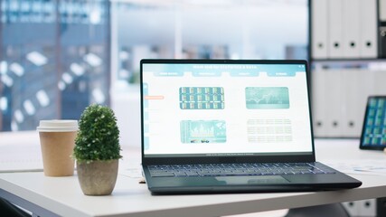 Poster - Stock portfolio on laptop containing investment assets affected by market volatility. Empty workplace with live index indices on notebook screen showing stock demand surge, close up