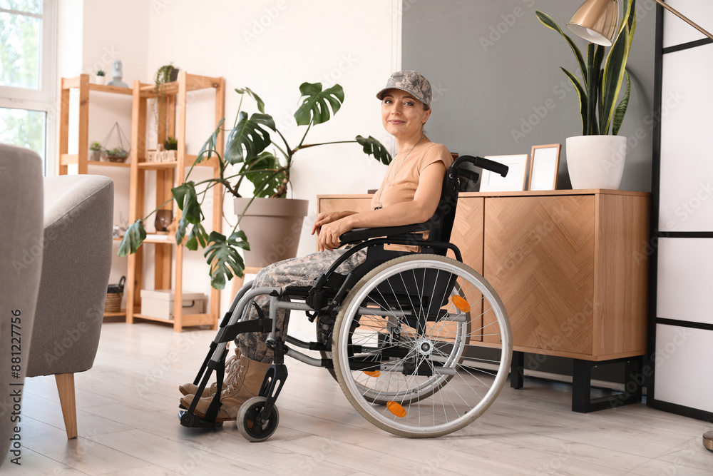 Female soldier in wheelchair at home