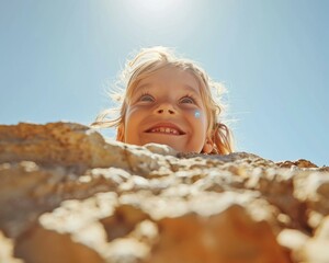 Wall Mural - A happy child is looking down from a rock. AI.