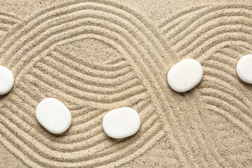 Wall Mural - White spa stones on sand background