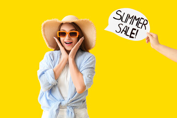 Poster - Beautiful young woman in sunglasses and paper with text SUMMER SALE on yellow background