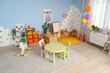 © Pixel-Shot - Stylish interior of modern playroom in kindergarten