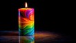 © Udomner - Colorful surrealistic candle in the dark with multicolored light on a black background , surrealism, candle