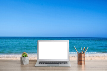 Poster - Workplace at beach, distant office. Table with laptop on sandy seashore. Mockup for design