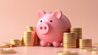 © Andres Mejia - Pink piggy bank standing near increasing stacks of gold coins on pink background