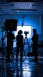 © Da - Abstract Wallpaper Featuring Professional Studio Setup for Live Streaming and Film Production: Silhouettes of Workers, Lighting Equipment, and Cameras. Ideal for Editorial Content and Book Covers, Hig