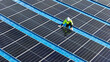 © ultramansk - Worker Technicians are working to construct solar panels system on roof. Installing solar photovoltaic panel system. Men technicians walking on roof structure to check photovoltaic solar modules.