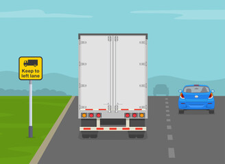 Wall Mural - Safe driving tips and traffic regulation rules. Back view of a heavy goods vehicle on motorway. 