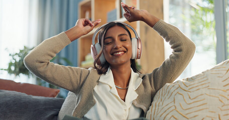 Wall Mural - Dance, woman and music with headphones on couch for radio, subscription and mobile app. Listening, streaming and happy female person in living room for sound, podcast and online audio on sofa in home