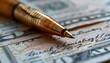 © Asif - Image of a pen resting on a pile of cash, representing financial management.