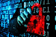 © Phichitpon - a hacker in a dark hooded holds a digital padlock against a digital code background showing cyber security and hacking and data process