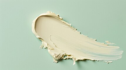 Poster - A Smooth Swipe of Creamy White Lotion on a Light Green Background