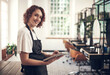 © CanBorg/peopleimages.com - Smile, portrait and woman with tablet at hair salon for appointment, information and client records. Small business, stylist and person with tech at spa for online, schedule or beauty tips on website