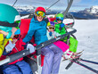 © Sergey Novikov - Family ready for a fun ski lift ride laughing and screaming