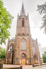 Wall Mural - View at the Basilica of Holy Cross in the streets of Raalte - Netherlands