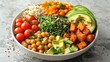 © Nat - Healthy Buddha bowl with avocado, chickpeas, tomato, quinoa, greens, and roasted vegetables on a marble surface.