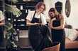 © CanBorg/peopleimages.com - Salon, haircut and teamwork with girl, customer and hair for grooming or wellness. Beauty, client and scissors with creative style, beautician at work with employee for startup haircare service