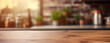 © NOPPHINAN - Rustic wood table top with a blurred background of a modern kitchen
