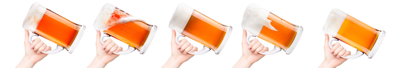 Wall Mural - Woman hand holding mug of beer with bubble froth isolated on white background.